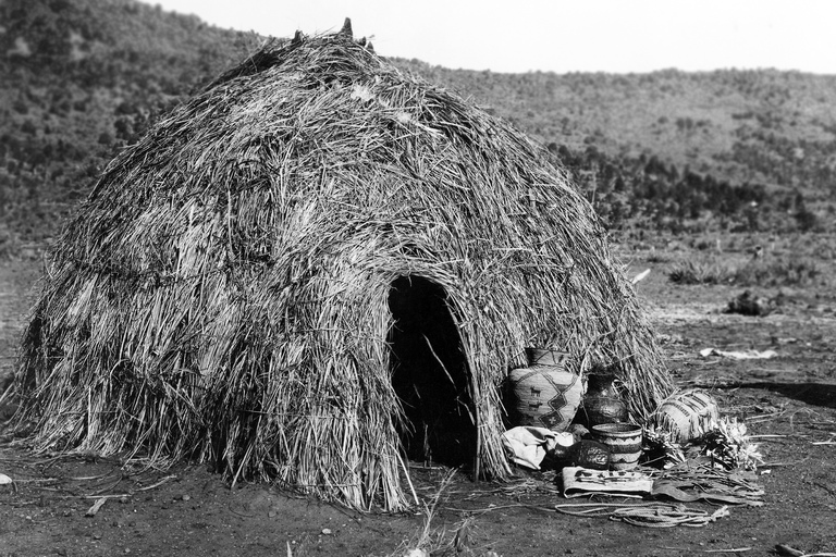 Apache wickiup in the Southwest US, photographed by Edward Curtis in 1903. (Click for a higher-resolution version.) Image from the Wikipedia article “Wigwam”; in the public domain.