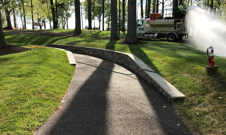 The accessible path leading to the Chrysalis. (Click for a higher-resolution version.)  The view is looking up the hill from the alpha stage to the Merriweather Post Pavilion VIP parking lot. Image © 2017 Inner Arbor Trust; used with permission.