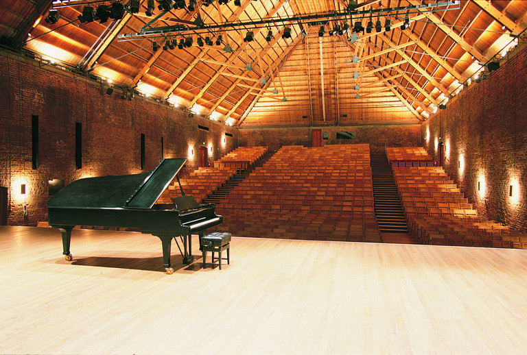 Snape Maltings Concert Hall, built in 1966&ndash;1967 as part of the repurposing of a old malt house in the village of Snape, in Suffolk, England. (Click for a higher-resolution version.) This was one of Arup’s first major projects in theater design and acoustic consulting. Image © 2016 Arup; from the Arup Journal 50th Anniversary Issue.